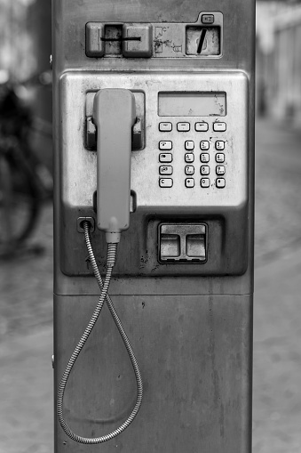 a public telephone in black and white