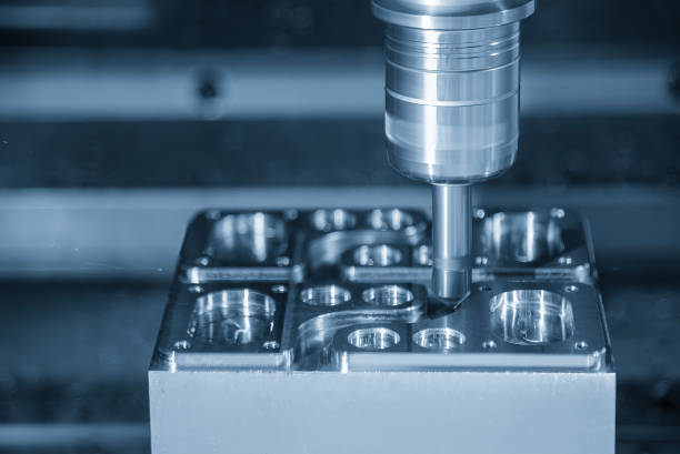 The CNC milling machine chamfer cutting mold base part by chamfer tool in the light blue scene.