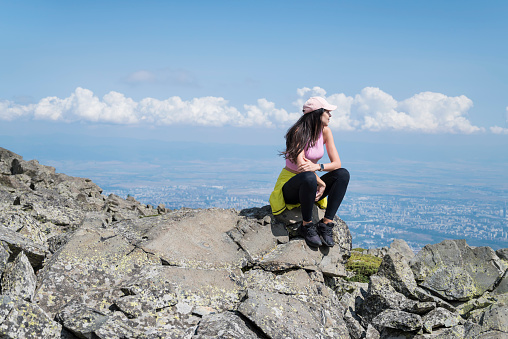 Woman  standing on a rocks in the summer  mountain .Vitosha Mountain ,Bulgaria