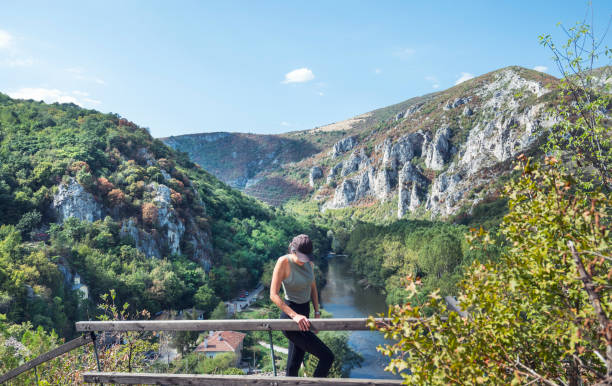 istock Traveler  Woman  standing above  river 1917230963