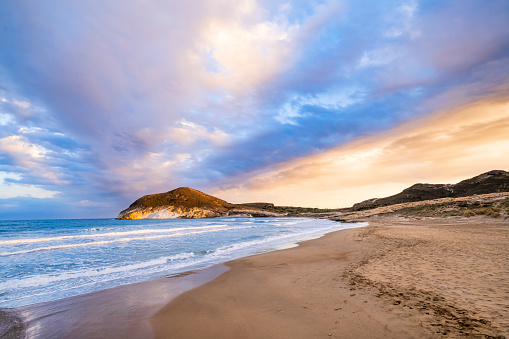 Summer sandy beach with a blue sea water