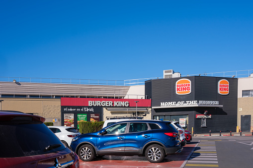 Valencia, Spain - December 11, 2023: From a car park, a Burguer King restaurant.