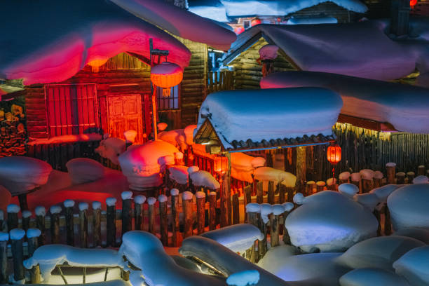 winter season snow town xuexiang with chinese lantern deep snow at night colorful lighting on snow-covered cottage - blizzard house storm snow zdjęcia i obrazy z banku zdjęć