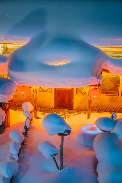 winter season snow town xuexiang with chinese lantern deep snow at night colorful lighting on snow-covered houses - blizzard house storm snow zdjęcia i obrazy z banku zdjęć