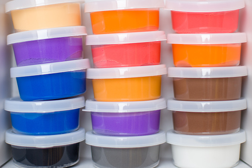 Transparent plastic containers with colorful air dry clay.
