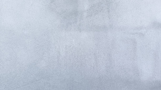 istock White cement textured wall background. concrete polished material texture background. 1917295439