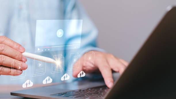 istock Online streaming concept, Online streaming audiences listen to live multimedia performances, movies, and broadcasts, accessing a cloud database for an immersive and dynamic entertainment experience. 1917297631