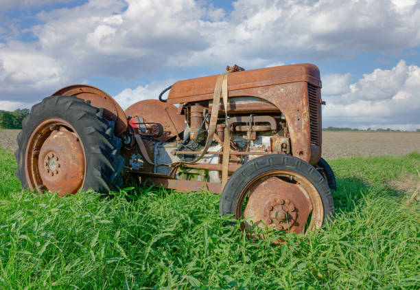 istock abandoned old and rusty Tractor on Field in North Frisia,Germany 1917299217