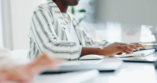 istock Hands, computer keyboard or professional person typing online report, design development or social network project. Closeup, designer or agent working on feedback, review or update advertising media 1917315439