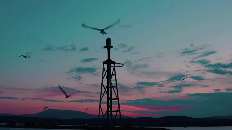 Aerial shot of Sukho lighthouse at sunset, bright sun shine low stock video