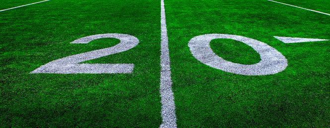 Football field green grass white yard markers to touchdown competition game