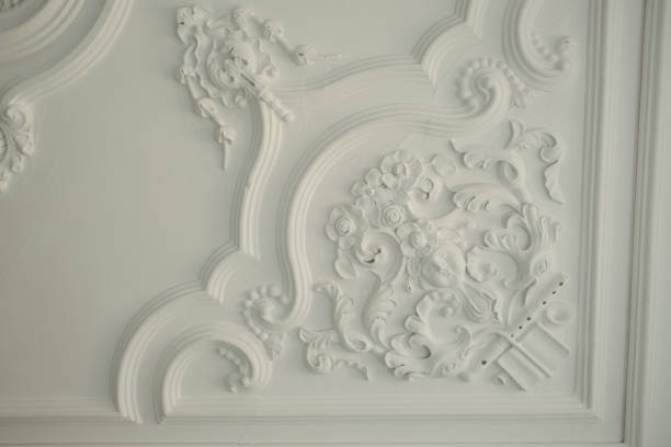 istock some beautiful white decor on the ceiling in a room with many details 1917347212