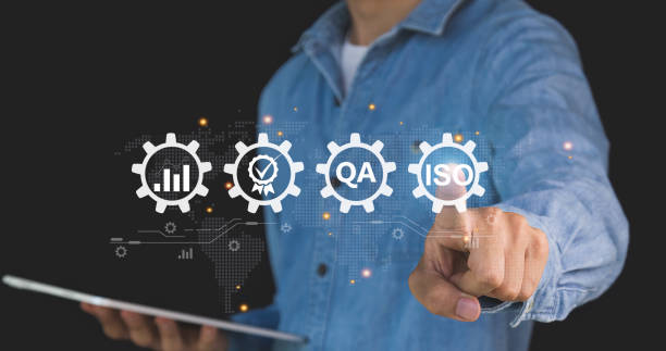 istock Businessman ISO symbol showing quality assurance on virtual screen 1917355285