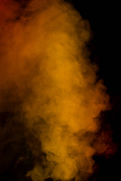 Orange and red steam on a black background. Copy space.