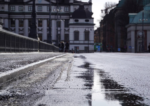 istock a puddle of water on city streets 1917357511