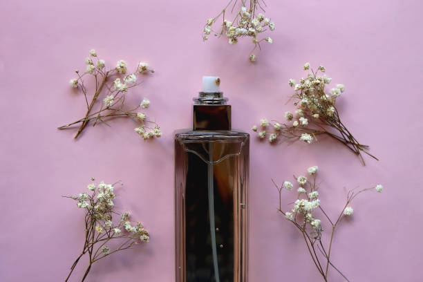 istock Perfume Bottle and Gypsophila Flowers 1917391782