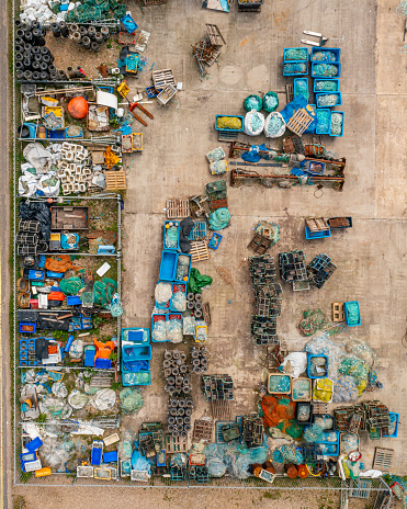 Aerial photo from a drone of a yard full of fishing equipment and tools.