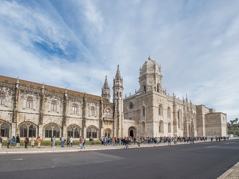 Lisbon, Portugal, January 4, 2024: The Jerónimos Monastery is a former monastery of the Order of Saint Jerome near the Tagus River in the parish of Belém, in the Municipality of Lisbon, Portugal. It became the necropolis of the Portuguese royal dynasty of Aviz in the 16th century, but was secularized on December 28, 1833 by state decree and its ownership transferred to the Real Casa Pia charity in Lisbon.