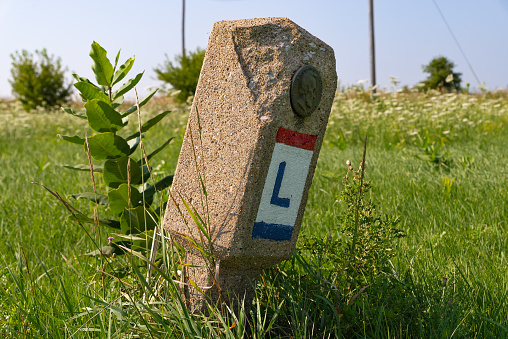 Original Lincoln Highway Marker, installed in 1928, in Franklin Grove, Illinois, USA.