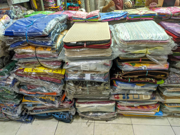 istock pile of carpets in plastic packaging ready for sale 1917504961