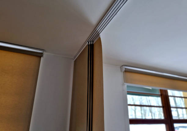 istock extendable hanging blind is a dividing partition made of textile beige blinds. home screen in the living room or dining room. rails and travel cable 1917526989