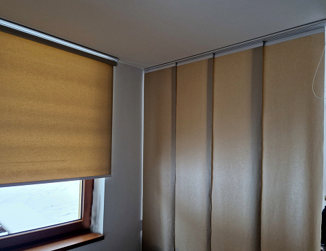 extendable hanging blind is a dividing partition made of textile beige blinds. home screen in the living room or dining room. rails and travel cable, interior, rail, awning window