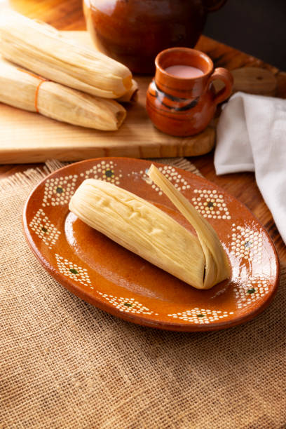 istock mexican tamale on clay plate 1917540072