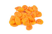 Golden appetizing dried apricots isolated on white.