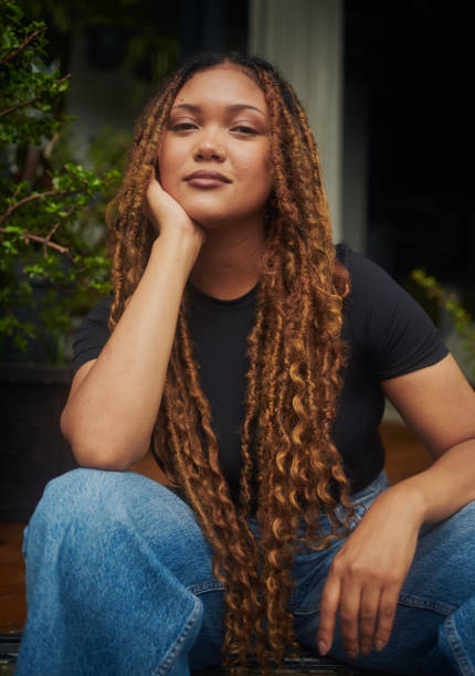 istock A beautiful woman sitting down and enjoying a quiet moment. 1917552708