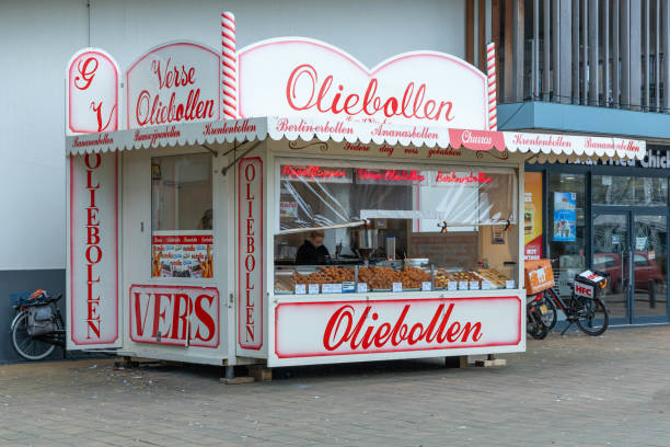 Utrecht, the Netherlands. 28 December 2023. Oliebollen kraam, deep fried doughnut balls called oliebollen, a typical Dutch new year’s eve treat tradition, at a food stand in the streets.