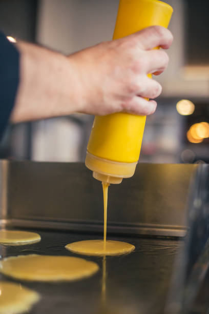 istock Chef pour dough on cooktop stock photo 1917583105