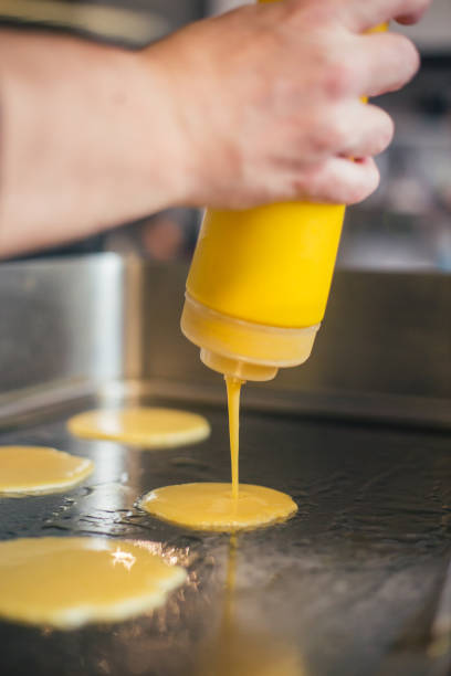 istock Chef pour dough on cooktop stock photo 1917585219