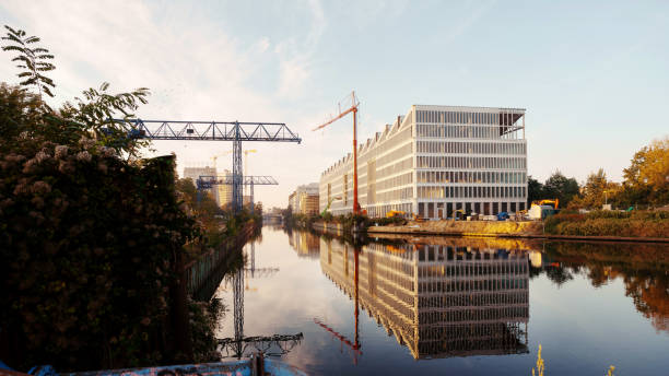 istock Construction site of a modern office building by a river 1917587816