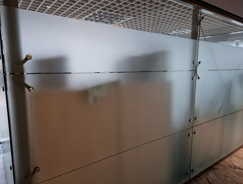 glass building where the walls are made thick walled glass with smoky opaque color. held together by drilled joints and stainless steel screws. trade stand office, light, corridor, hygiene, hygienic, crossbar, facility, glass panels, opacity