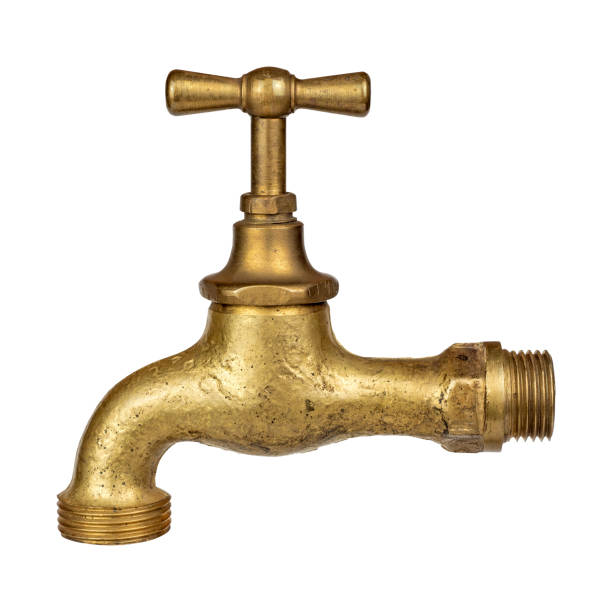 Old used golden copper metal vintage faucet isolated on white background