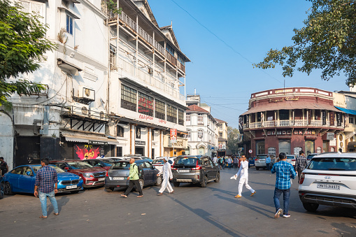 Mumbai, Maharashtra, India, 1st of January 2024, A cityscape wwith Colonial architecture and pedestrians,