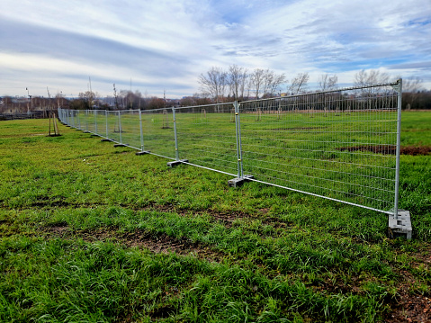 stability of the fence is maintained by construction sites with portable fence parts that are installed in plastic load-bearing weights. prevent the movement of unauthorized persons, demonstration, installed