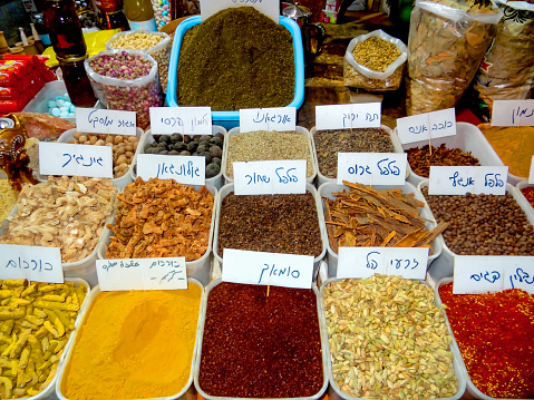 Various seasonings and spices are sold at an oriental bazaar.  Mahaneh Yehudah Jerusalem, Israel - September 10, 2023