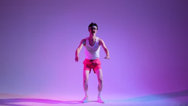 Mustached Nerd in Glasses Does Squats on Purple Background