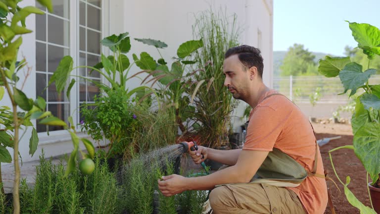 Millennial Man planting flower for new season