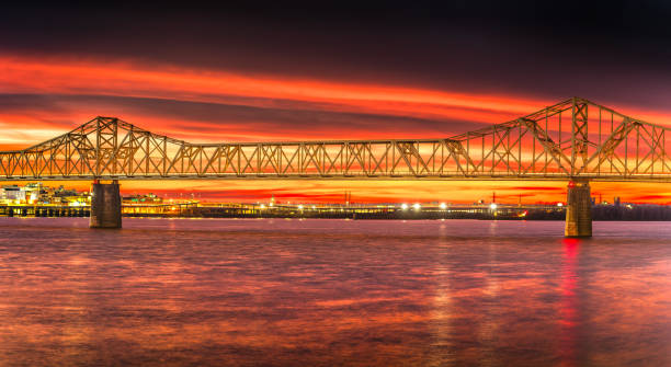 istock a bridge over water with a red sky in the background 1917724787