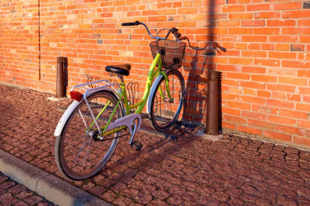 istock Bicycle near a red brick wall. Bicycle with wicker basket. 1917736890