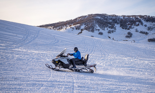 Speeding on a snowmobile in Colorado, USA