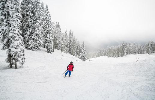 Young man skiing alone in Colorado USA