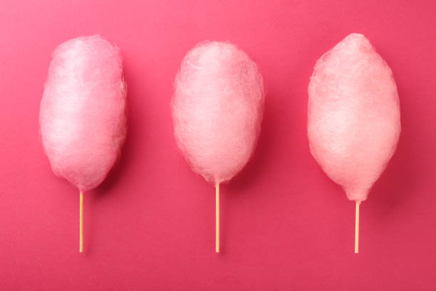 istock Sweet cotton candies on pink background, flat lay 1917800650