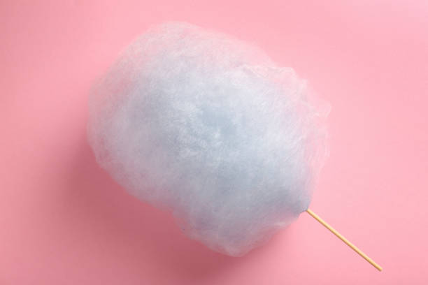 istock Sweet light blue cotton candy on pink background, top view 1917800663