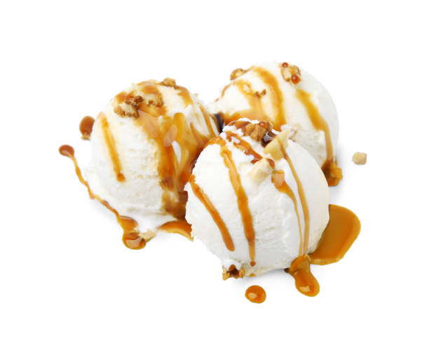 istock Scoops of ice cream with caramel sauce and nuts isolated on white 1917802879