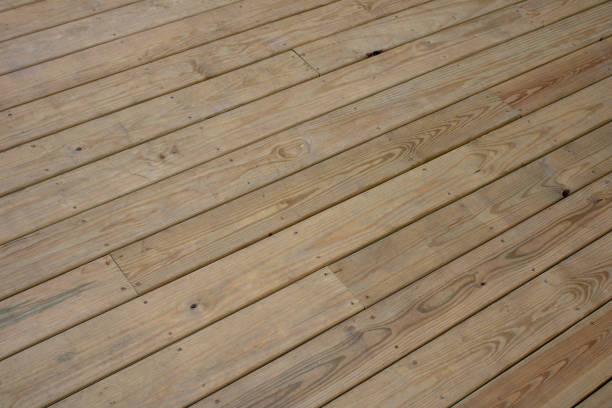 istock a small skate board sitting on a wooden deck next to a bench 1917814302