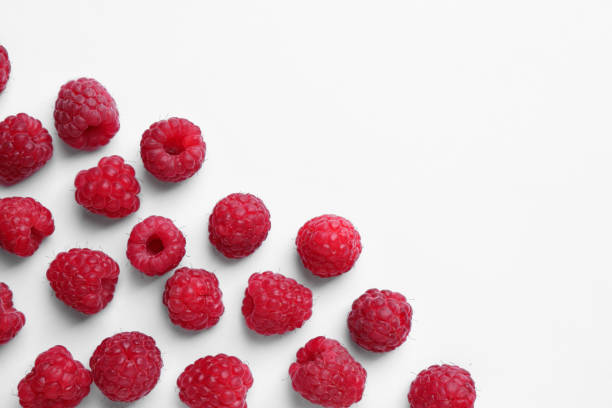 istock Tasty ripe raspberries on white background, flat lay. Space for text 1917836166