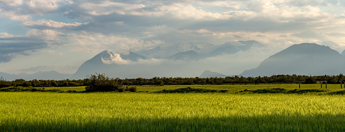 Mountain landscape with fields and cloudy sky. Turkey landscape.